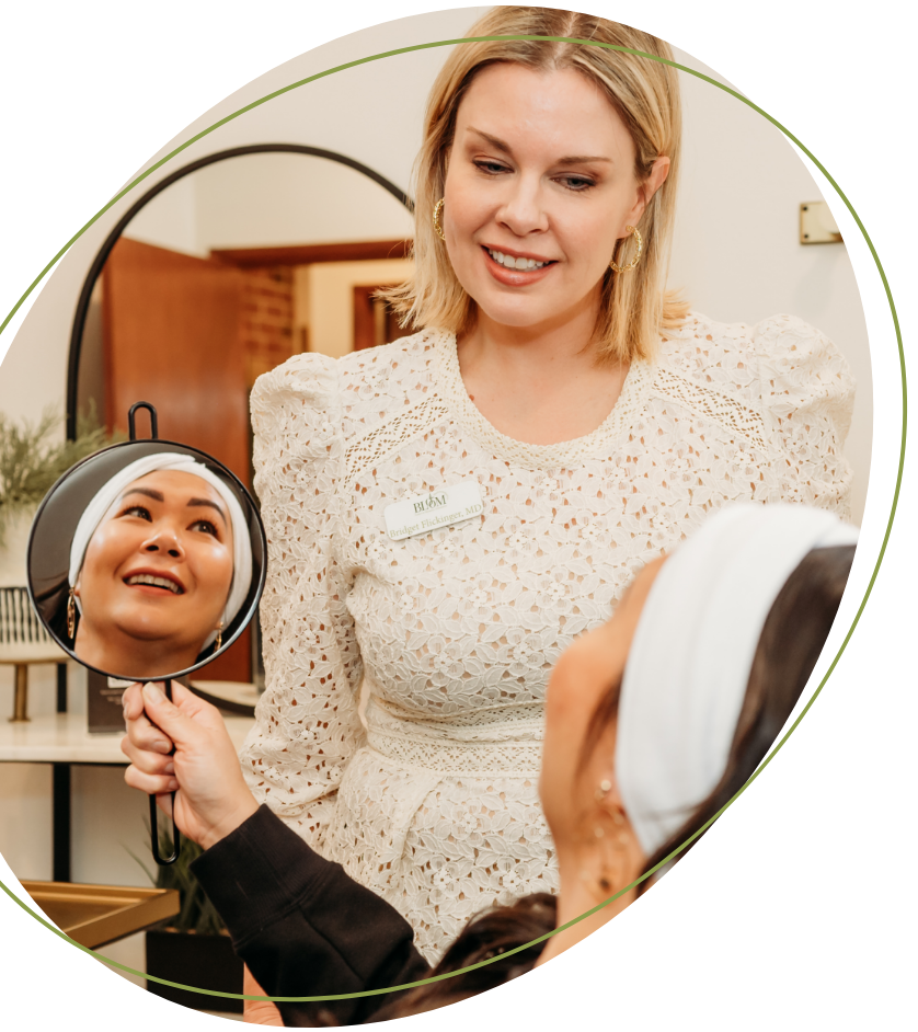 beautiful woman with large gold hoops and a tan halter top